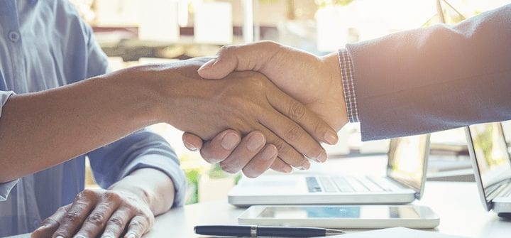 two people shaking hands